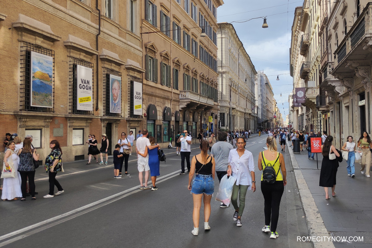 Tourists walk along via del corso, Rome